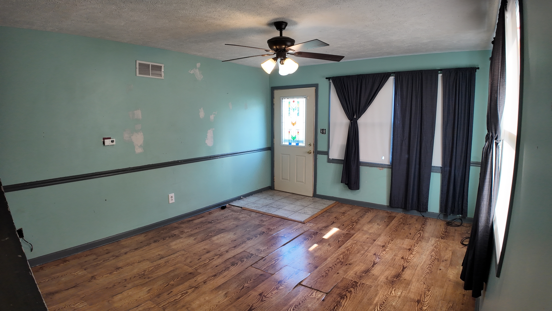 601 East Webster Street Clinton, IL 61727 - Photo 5 of 21 a view of empty room with wooden floor