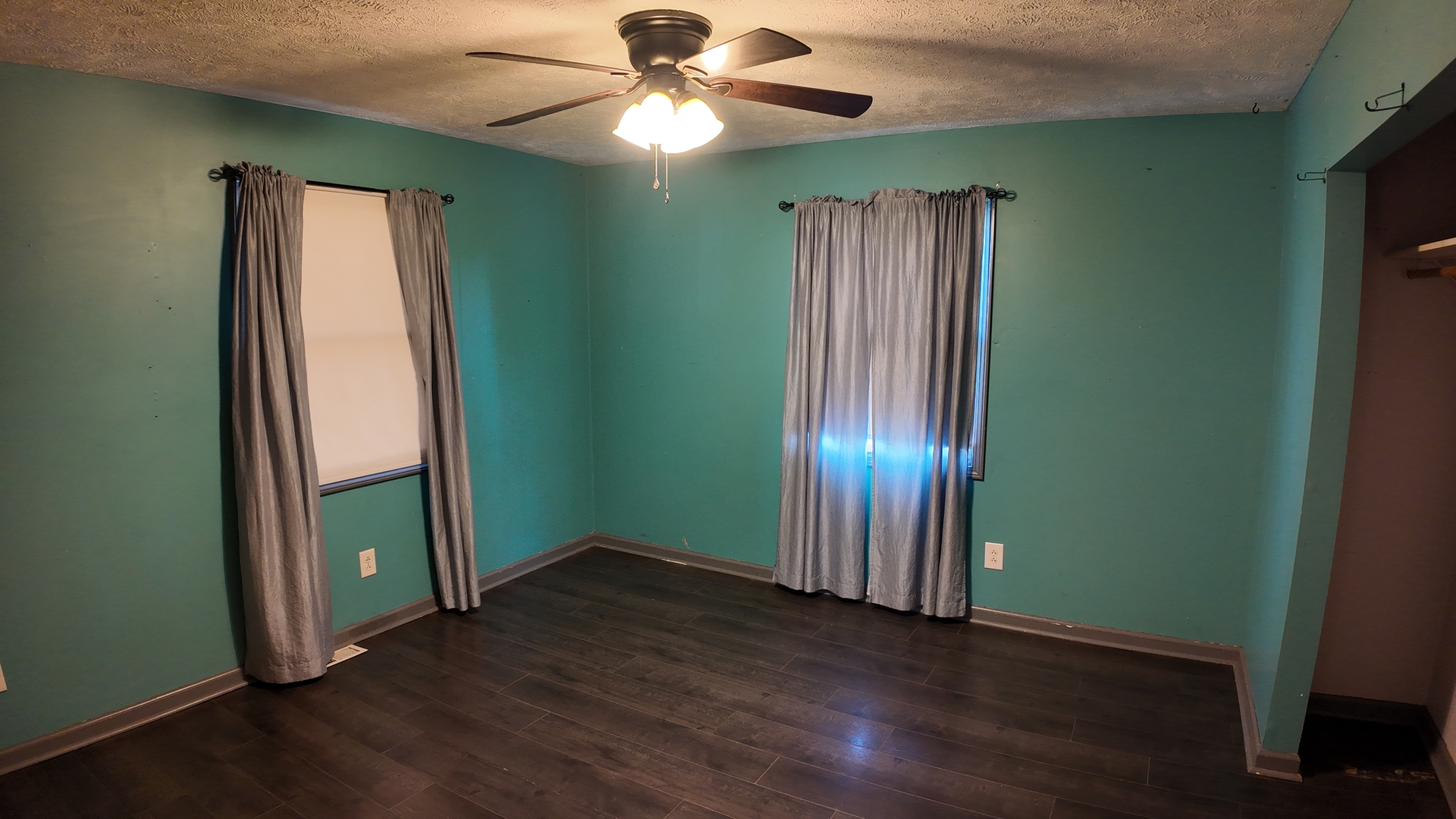 601 East Webster Street Clinton, IL 61727 - Photo 9 of 21 an empty room with wooden floor closet and window