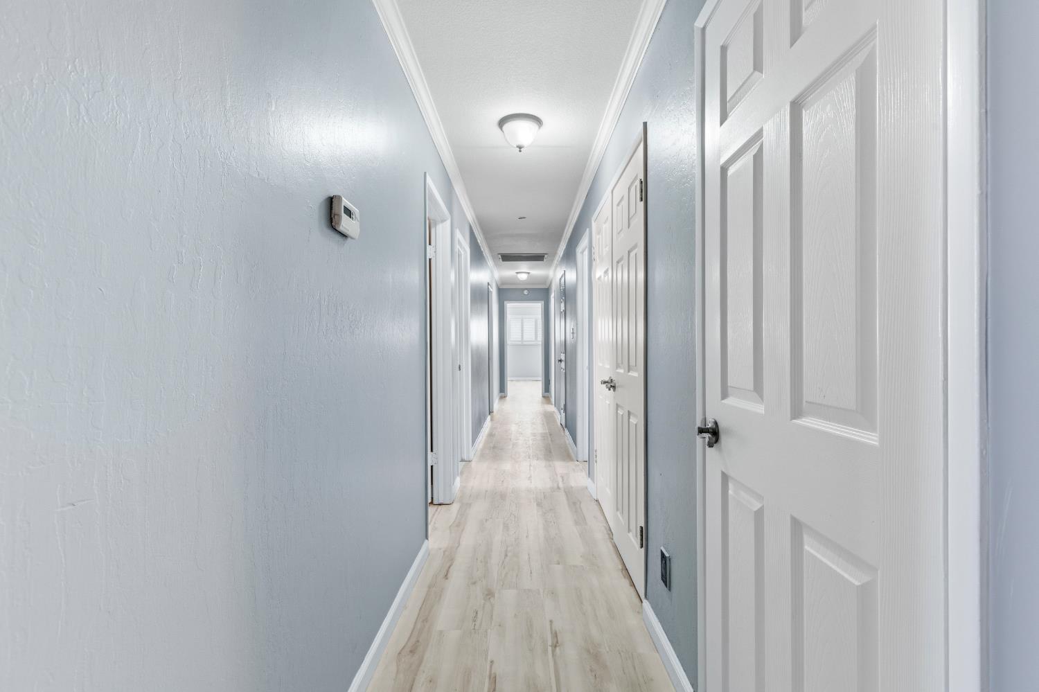 17500 Von Sosten Road Tracy, CA 95304 - Photo 17 of 50 a view of a hallway with wooden floor