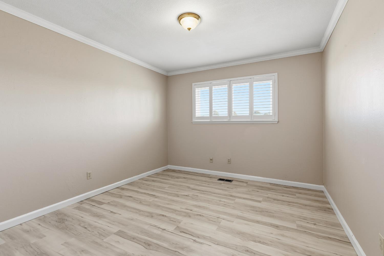 17500 Von Sosten Road Tracy, CA 95304 - Photo 18 of 50 wooden floor in an empty room with a window