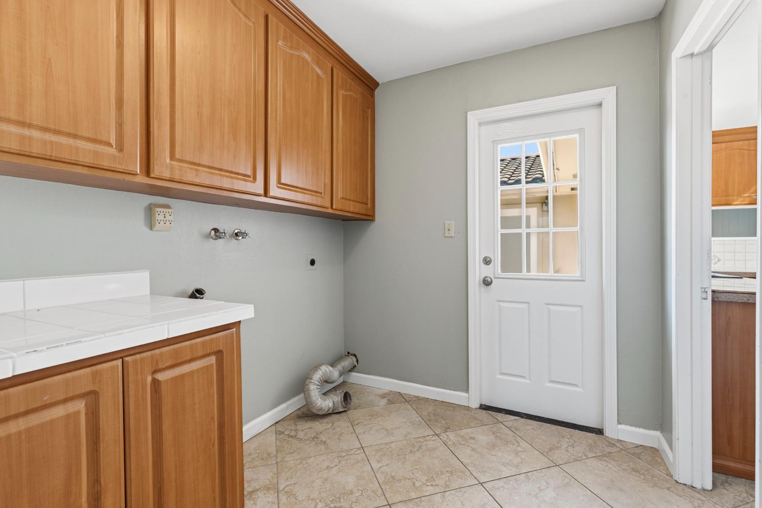 17500 Von Sosten Road Tracy, CA 95304 - Photo 20 of 50 a room with a sink cabinets and utility room