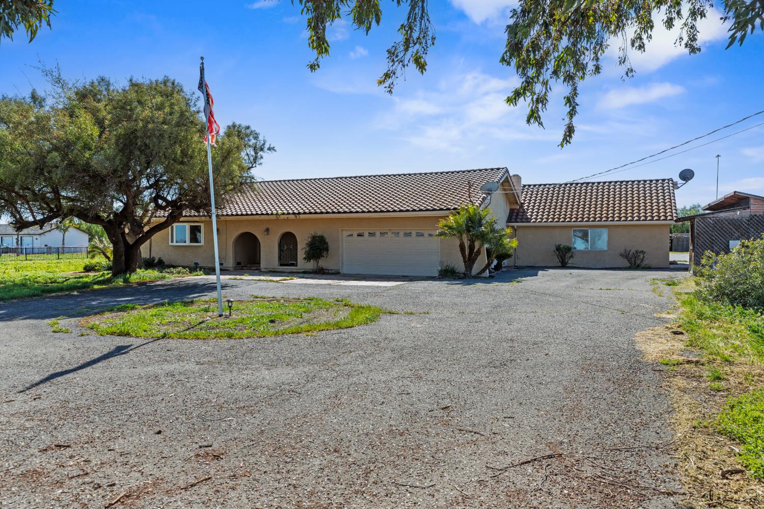 17500 Von Sosten Road Tracy, CA 95304 - Photo 2 of 50 a view of swimming pool with outdoor seating and house in the background