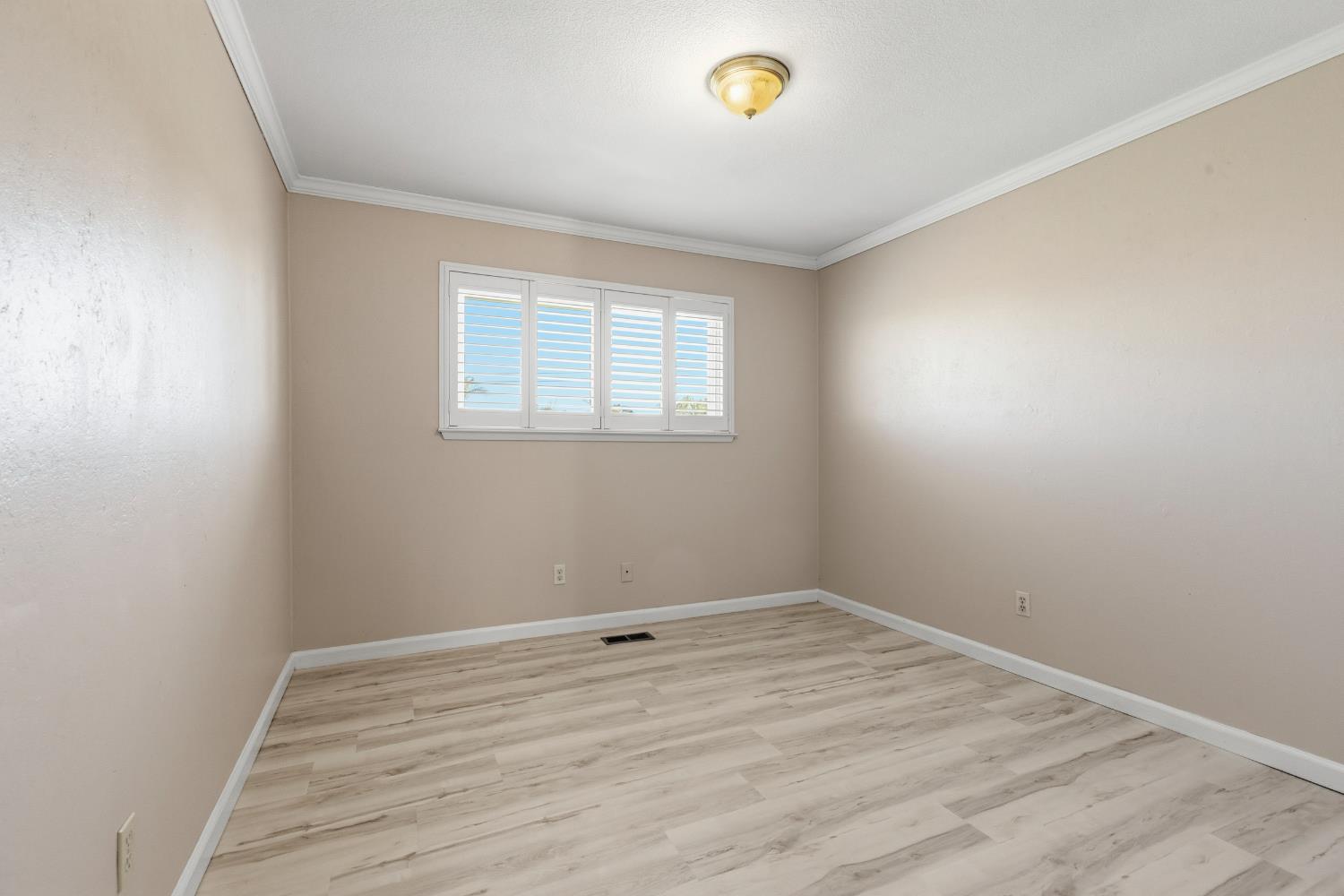 17500 Von Sosten Road Tracy, CA 95304 - Photo 21 of 50 an empty room with a empty space and a window
