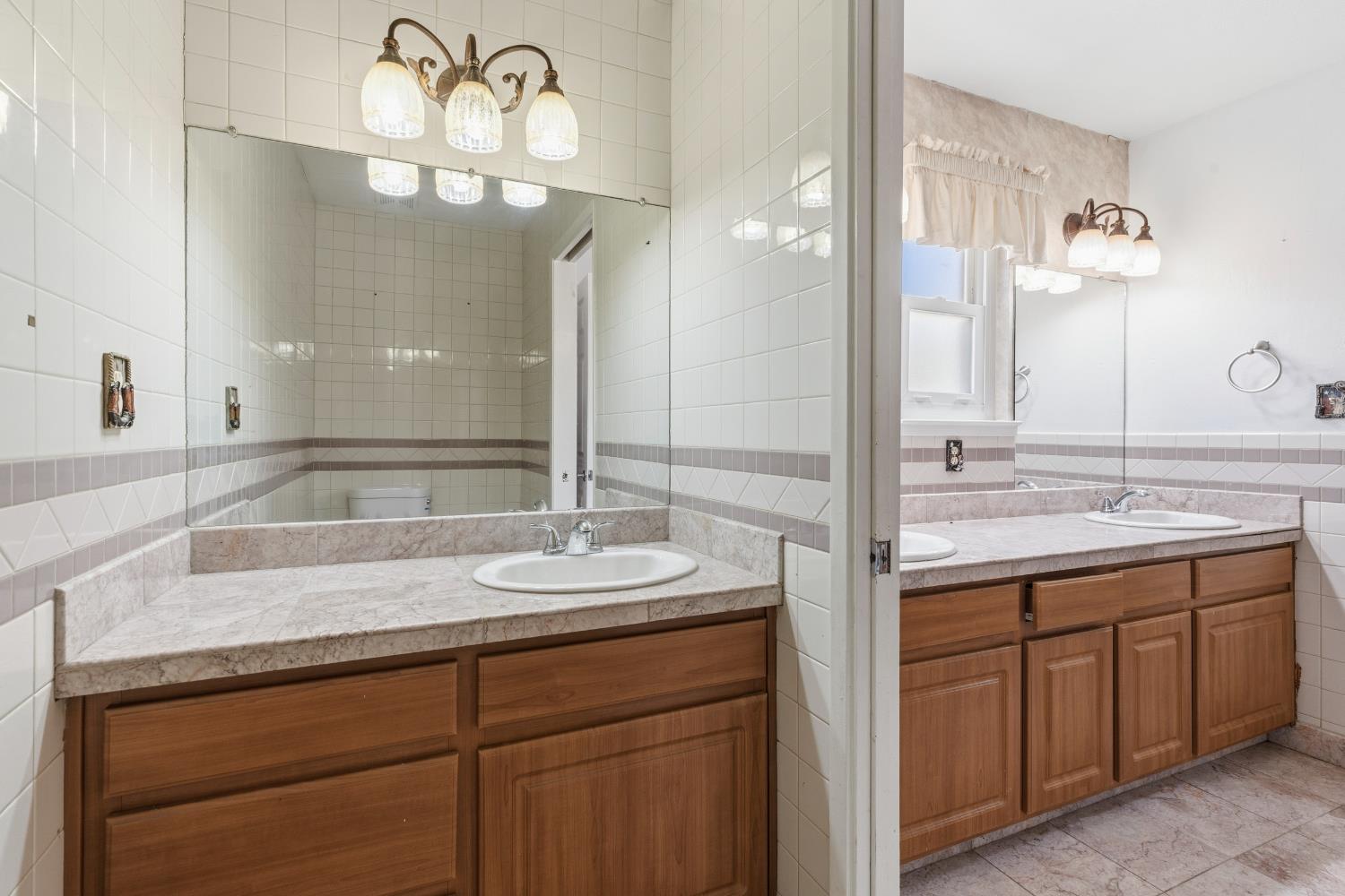 17500 Von Sosten Road Tracy, CA 95304 - Photo 23 of 50 a bathroom with a sink double vanity and a mirror