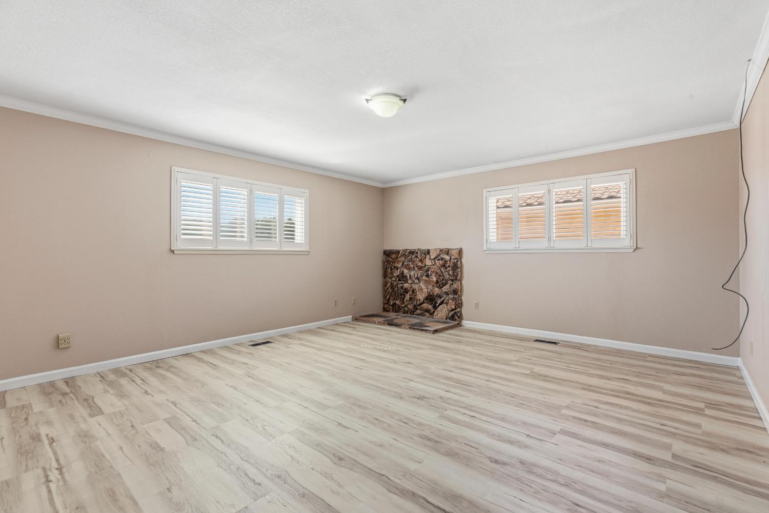 17500 Von Sosten Road Tracy, CA 95304 - Photo 24 of 50 a view of an empty room with wooden floor and a window