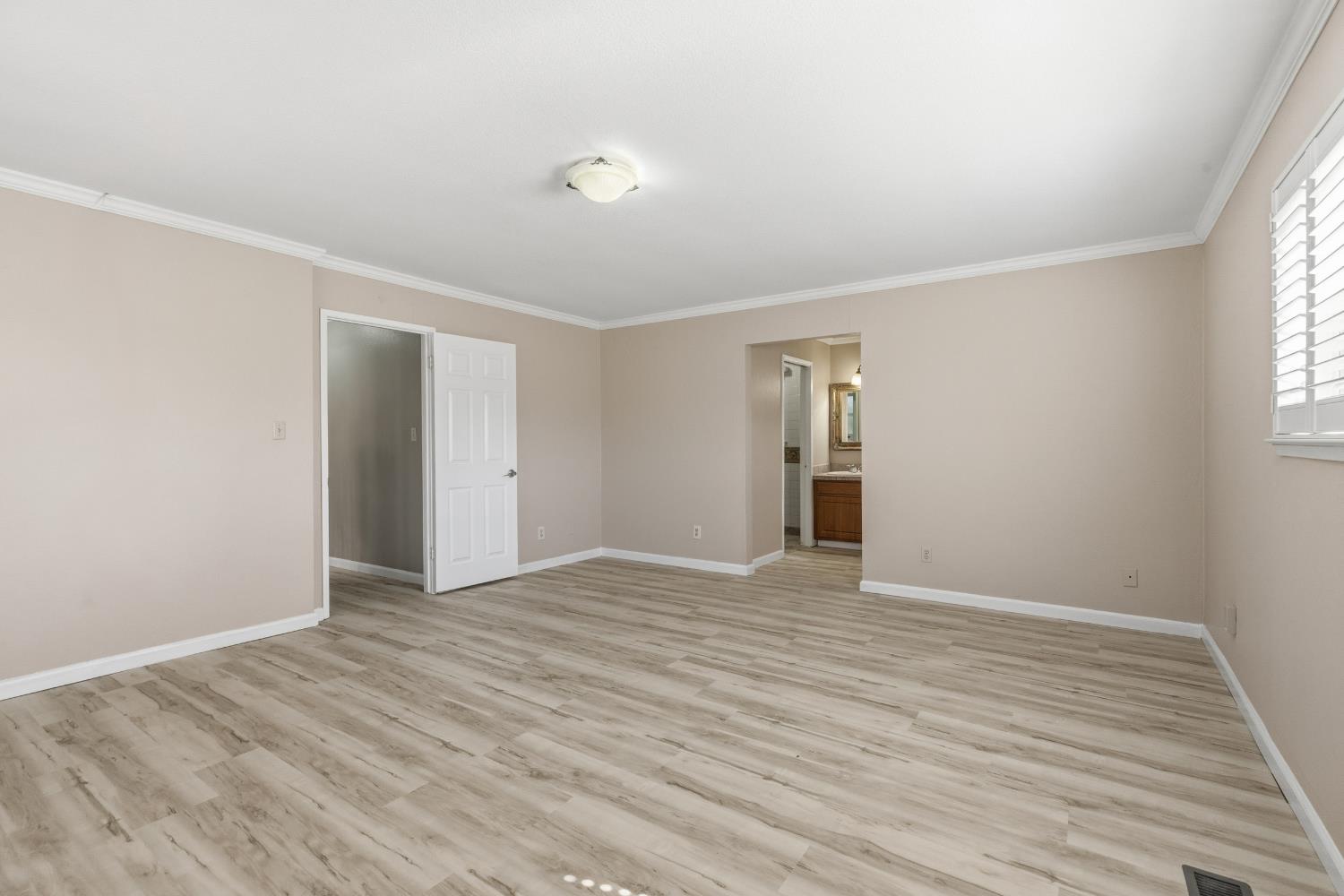 17500 Von Sosten Road Tracy, CA 95304 - Photo 25 of 50 a view of an empty room with wooden floor and a window