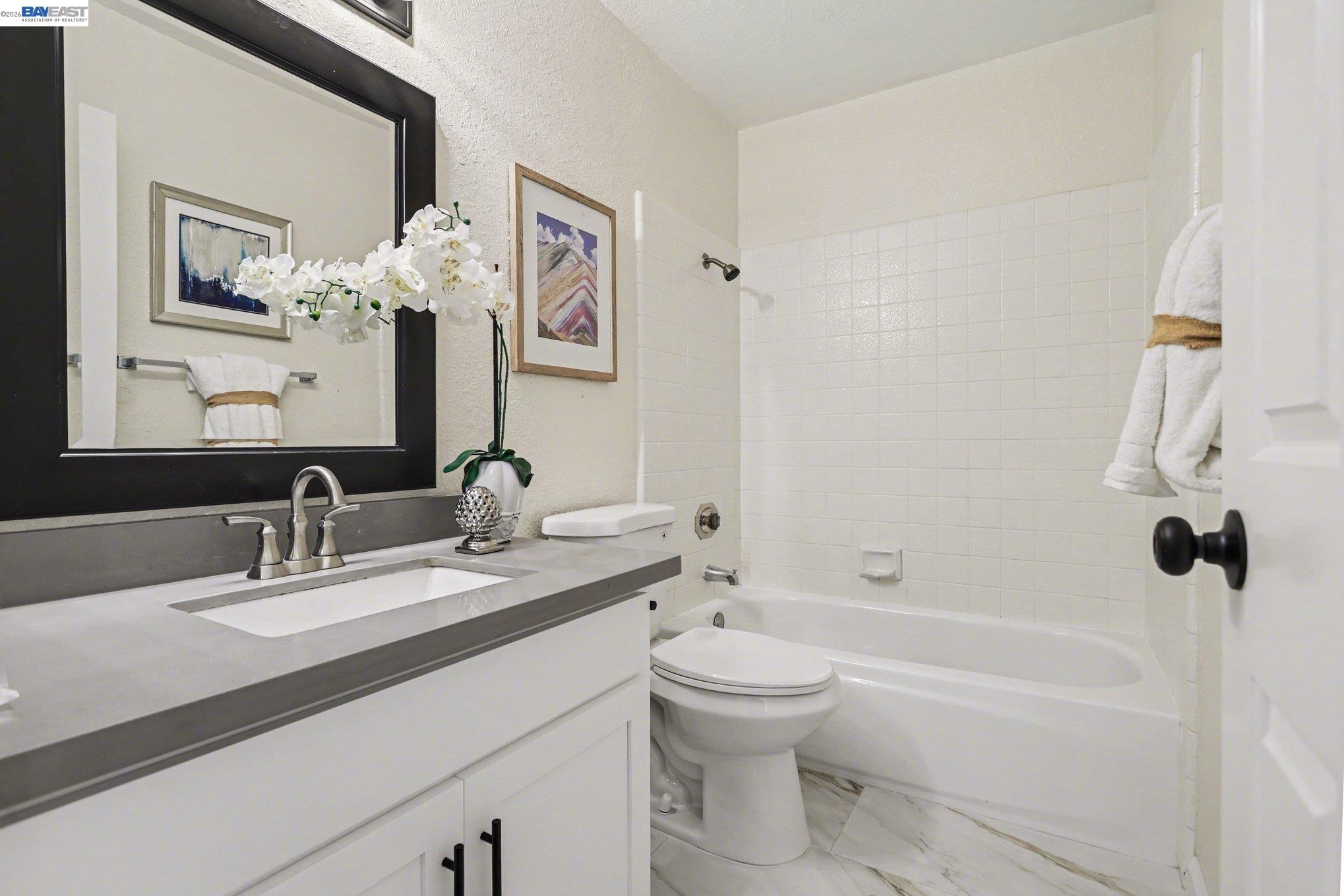 3683 Crow Canyon Road San Ramon, CA 94582 - Photo 16 of 24 a bathroom with a sink a toilet and shower