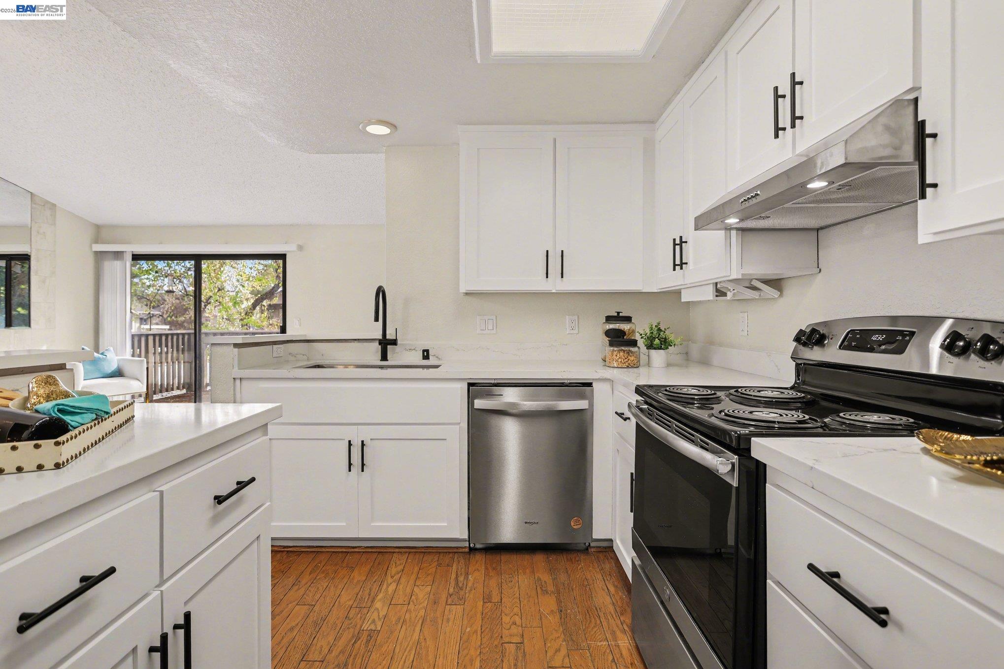 3683 Crow Canyon Road San Ramon, CA 94582 - Photo 7 of 24 a kitchen with cabinets appliances a sink and a window