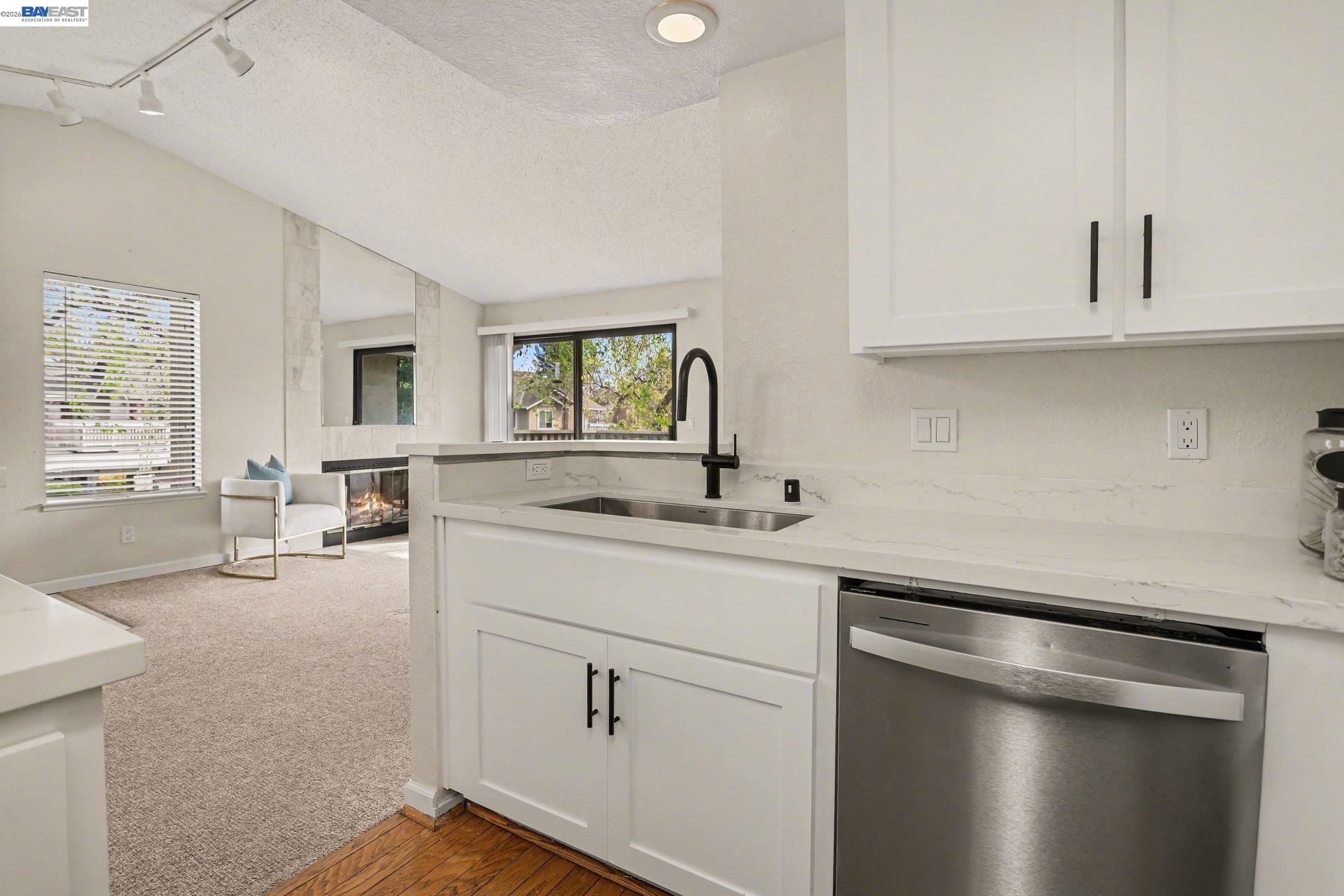 3683 Crow Canyon Road San Ramon, CA 94582 - Photo 9 of 24 a kitchen with sink cabinets and window