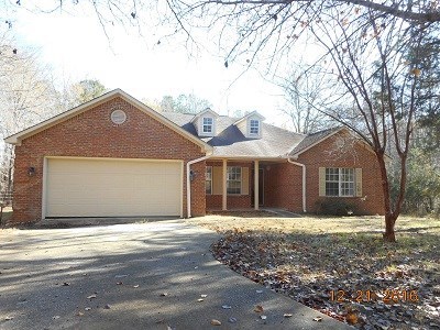 979 Old Cabaniss Road Forsyth, GA 31029 - Photo 1 of 33 a front view of a house with a garden