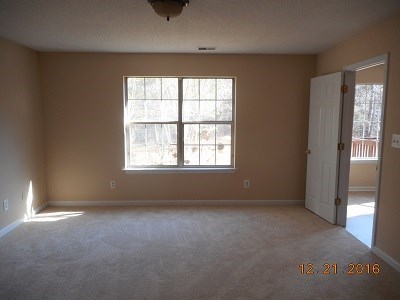 979 Old Cabaniss Road Forsyth, GA 31029 - Photo 14 of 33 an empty room with windows