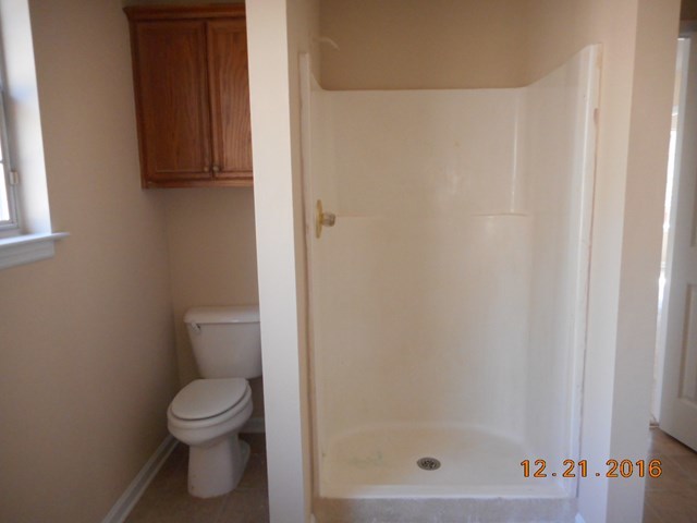 979 Old Cabaniss Road Forsyth, GA 31029 - Photo 16 of 33 a bathroom with a toilet and a shower
