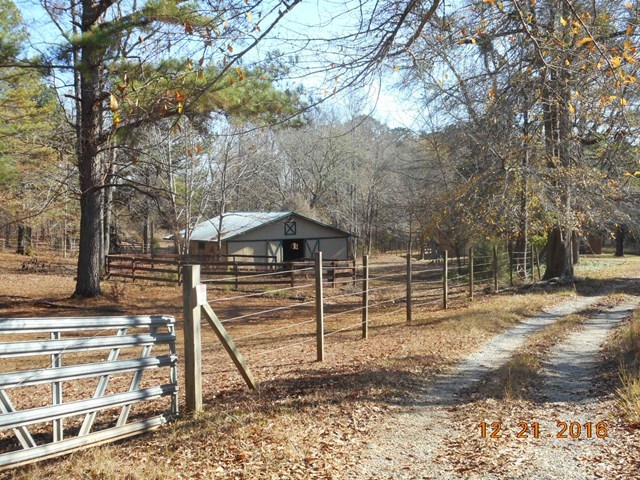 979 Old Cabaniss Road Forsyth, GA 31029 - Photo 3 of 33 a view of a house with a yard