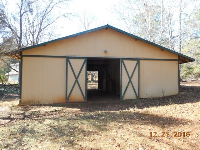 979 Old Cabaniss Road Forsyth, GA 31029 - Photo 25 of 33 a house with a outdoor space