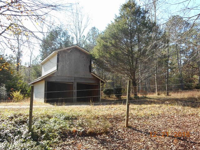 979 Old Cabaniss Road Forsyth, GA 31029 - Photo 29 of 33 a house with trees in the background