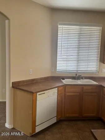 a stove top oven sitting inside of a kitchen
