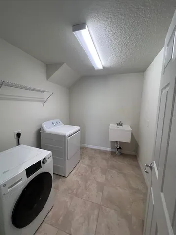 a utility room with dryer and washer