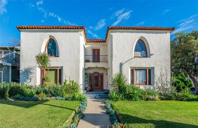 a view of house with garden and entryway