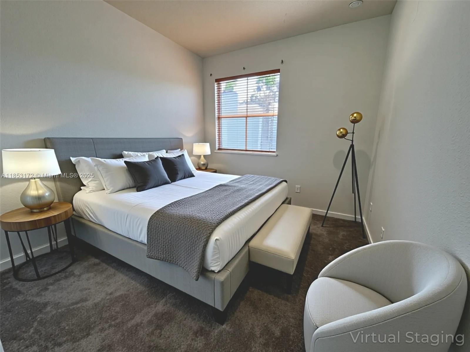 14046 Southwest 49th Street, Unit 16 Miramar, FL 33027 - Photo 13 of 22 a bed room with a bed and a couch