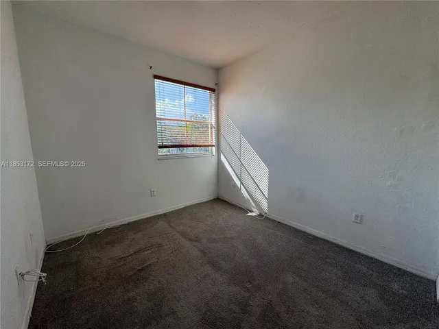 a view of a livingroom with wooden floor and closet