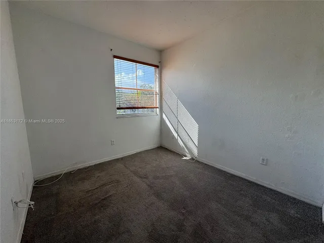 a view of a livingroom with wooden floor and closet