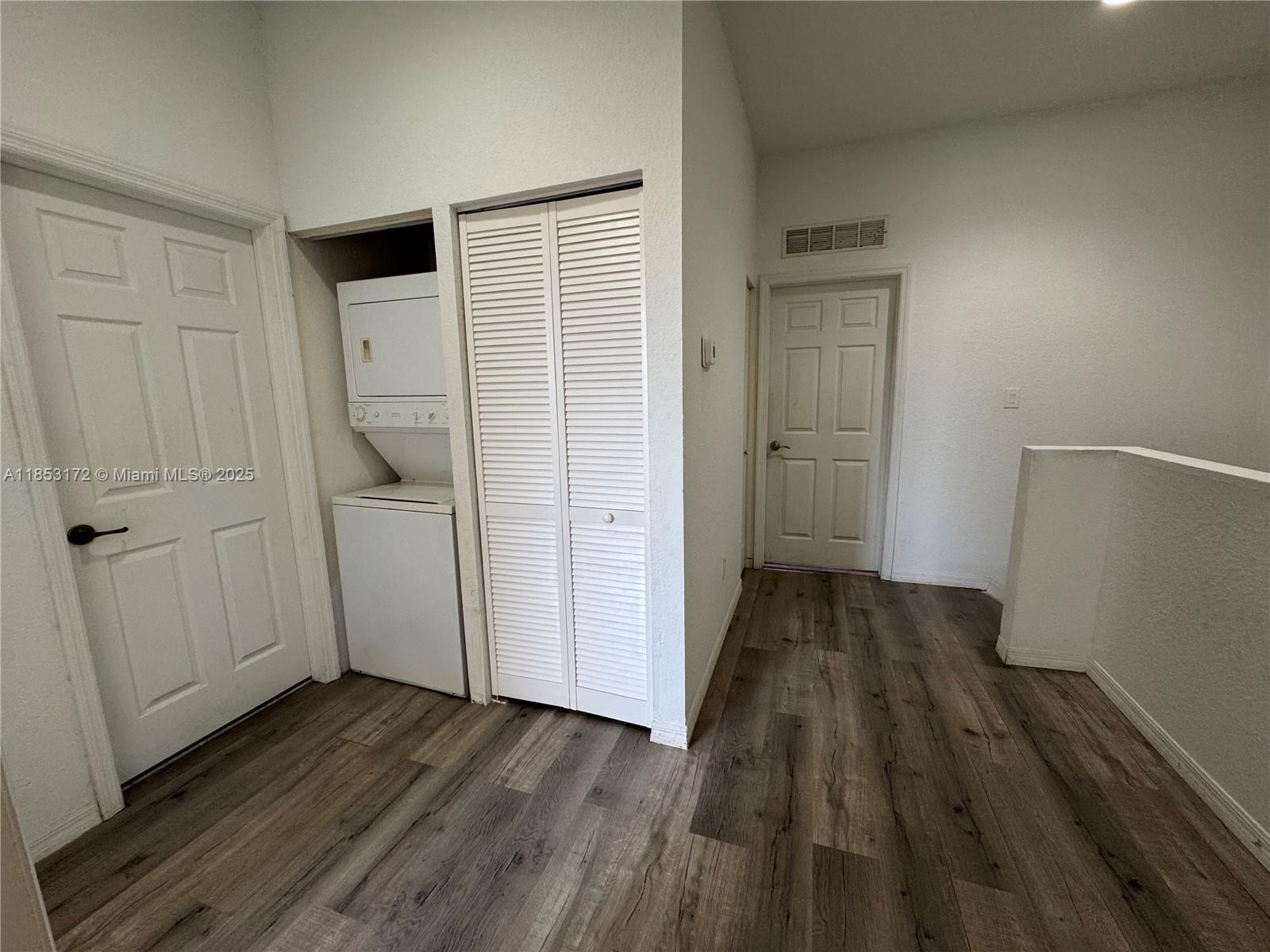14046 Southwest 49th Street, Unit 16 Miramar, FL 33027 - Photo 19 of 22 a view of a livingroom with wooden floor and closet