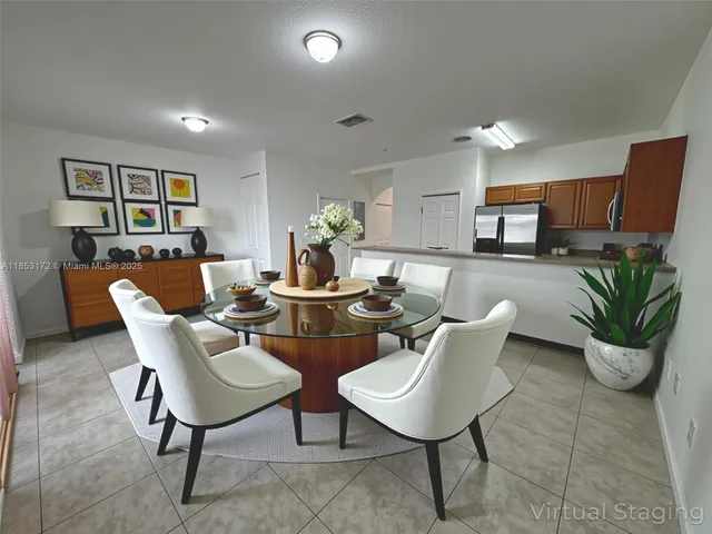 a view of a dining room with furniture