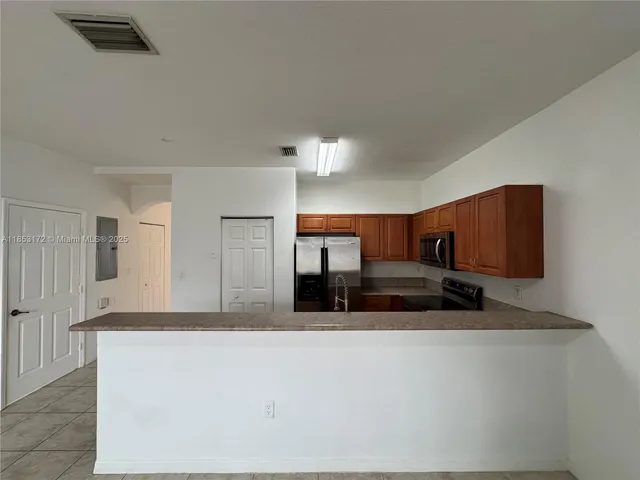 a large bathroom with a granite countertop sink and a mirror