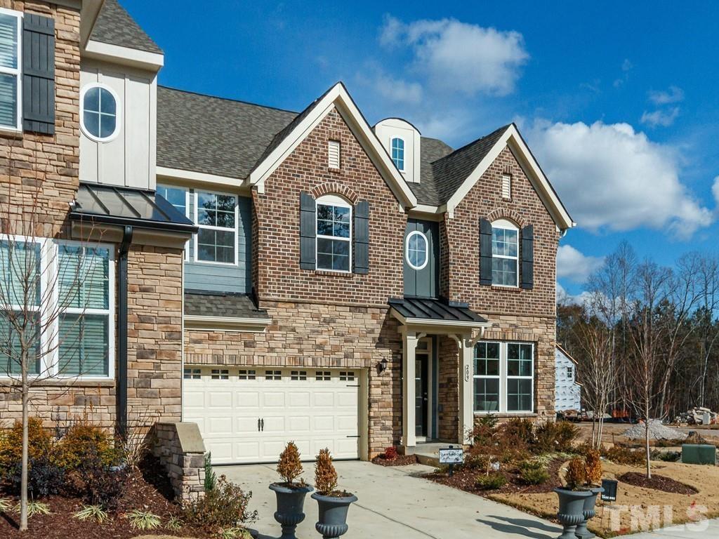204 Kentigern Drive, Unit 34 Raleigh, NC 27606 - Photo 16 of 33 a front view of a house with garden