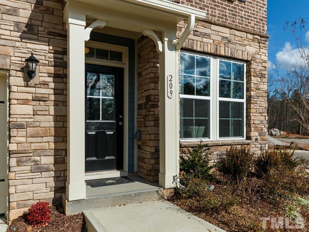 204 Kentigern Drive, Unit 34 Raleigh, NC 27606 - Photo 19 of 33 a view of a house with potted plants