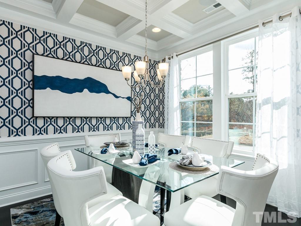 204 Kentigern Drive, Unit 34 Raleigh, NC 27606 - Photo 21 of 33 a view of a dining room with a table and chairs