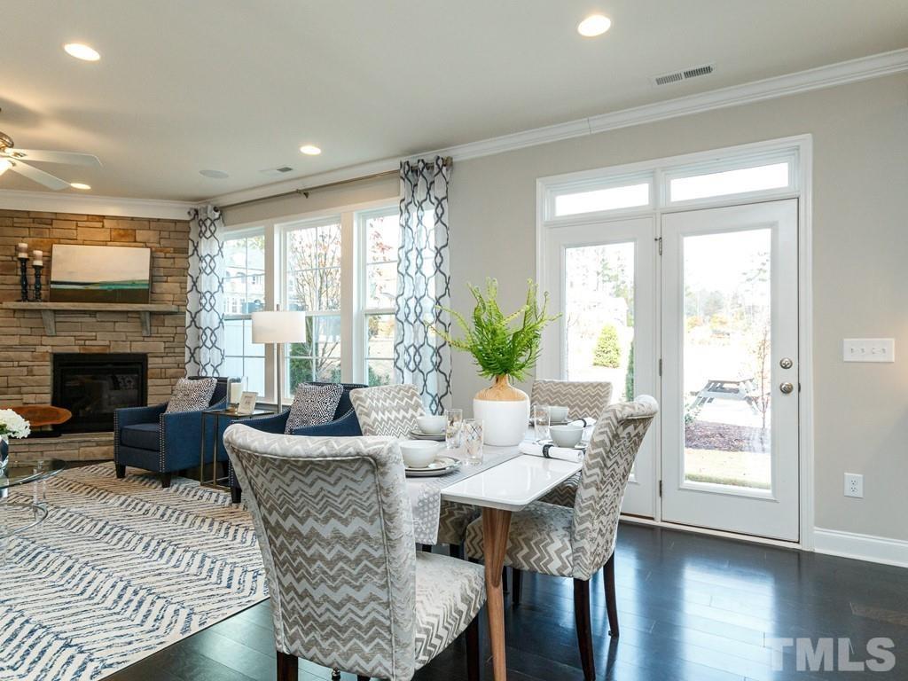 204 Kentigern Drive, Unit 34 Raleigh, NC 27606 - Photo 24 of 33 a view of a dining room with furniture window and wooden floor