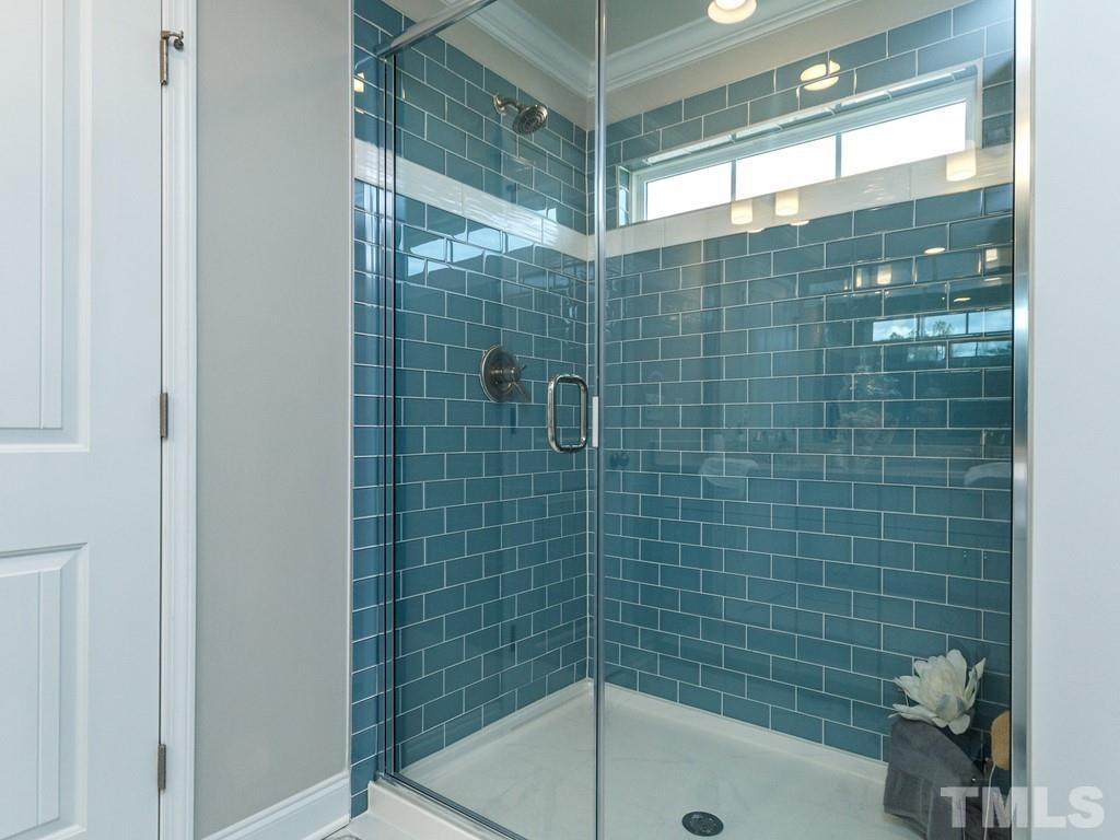 204 Kentigern Drive, Unit 34 Raleigh, NC 27606 - Photo 10 of 33 a bathroom with a shower and bathtub
