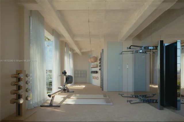a view of a hallway with closet and a window