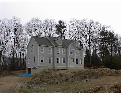 Lot 2 Brownloaf Road Groton, MA 01450 - Photo 1 of 1 a view of a white house next to a yard with large trees