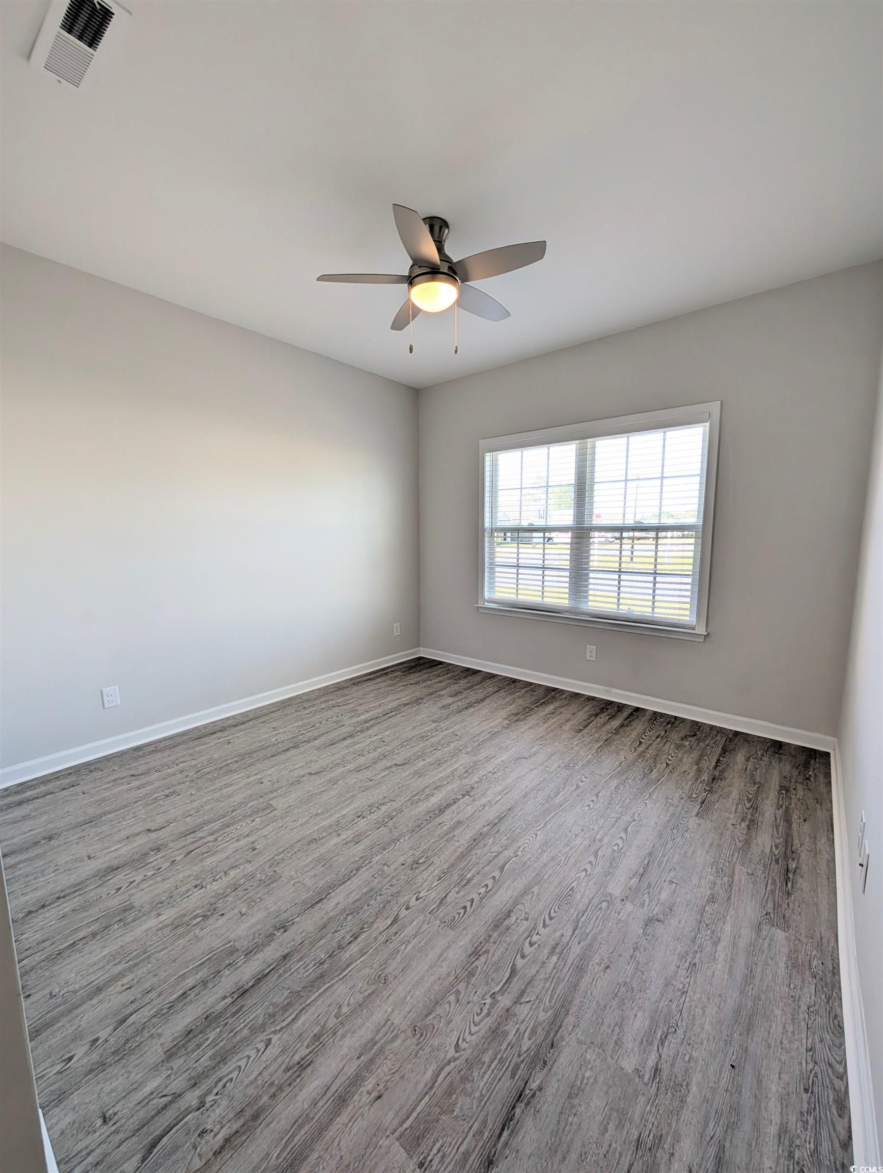 351 Lakota Loop Longs, SC 29568 - Photo 19 of 31 Spare room with wood finished floors and a ceiling fan