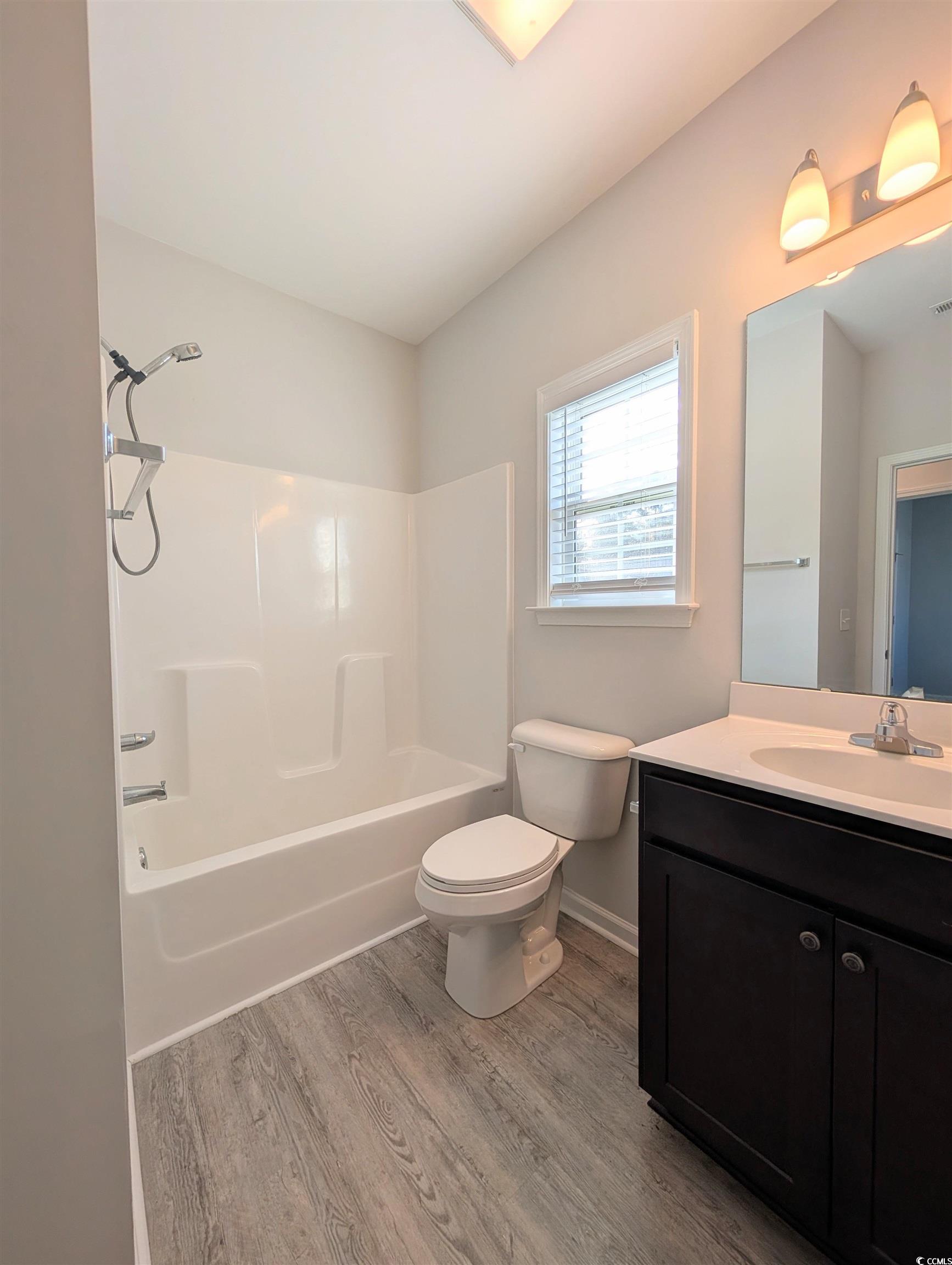 351 Lakota Loop Longs, SC 29568 - Photo 20 of 31 Full bathroom featuring vanity, shower / tub combination, and light wood-type flooring