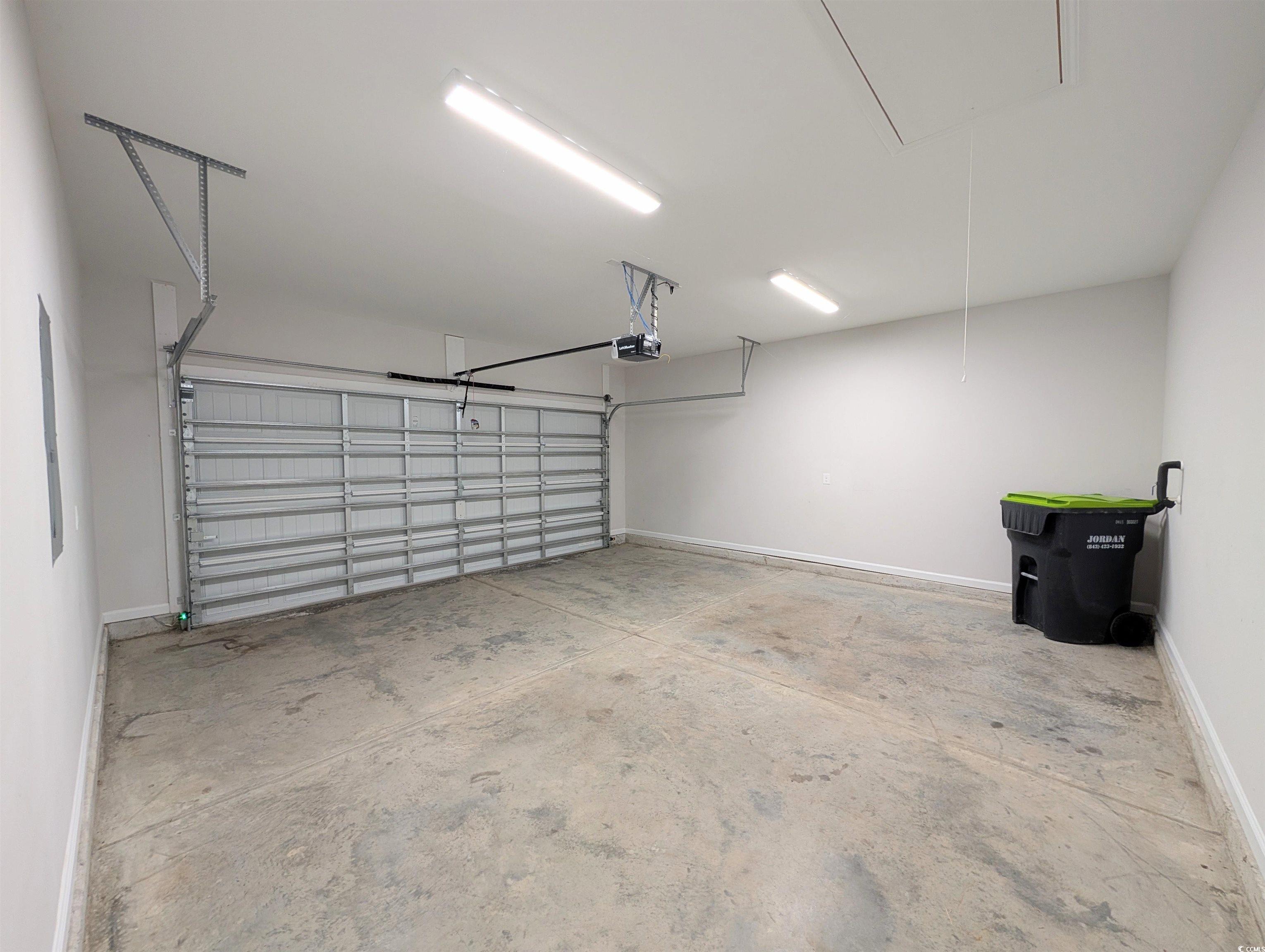 351 Lakota Loop Longs, SC 29568 - Photo 23 of 31 Garage with baseboards and electric panel