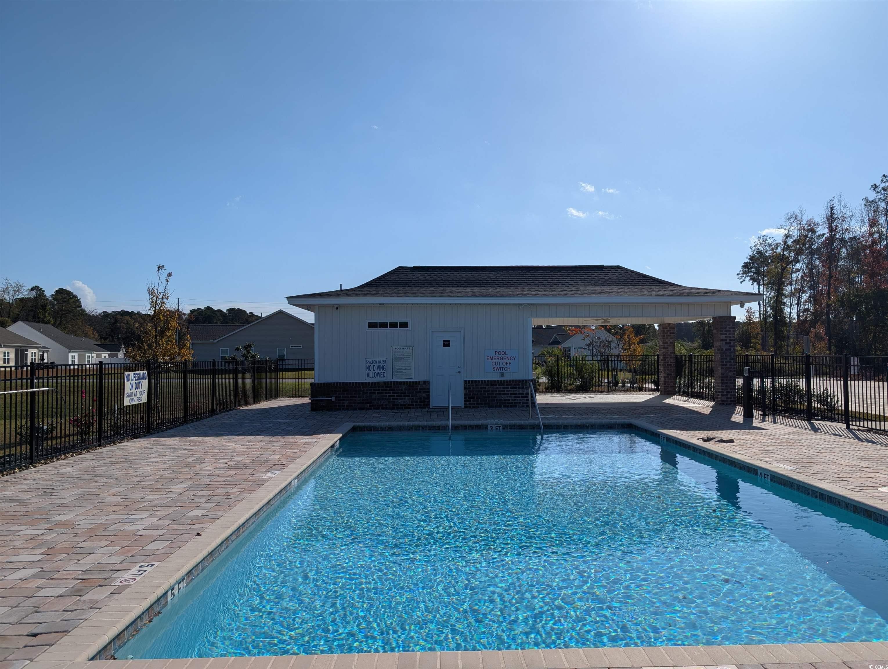 351 Lakota Loop Longs, SC 29568 - Photo 29 of 31 Community pool featuring a patio