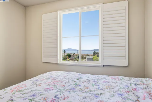 a bathroom with a tub shower and toilet
