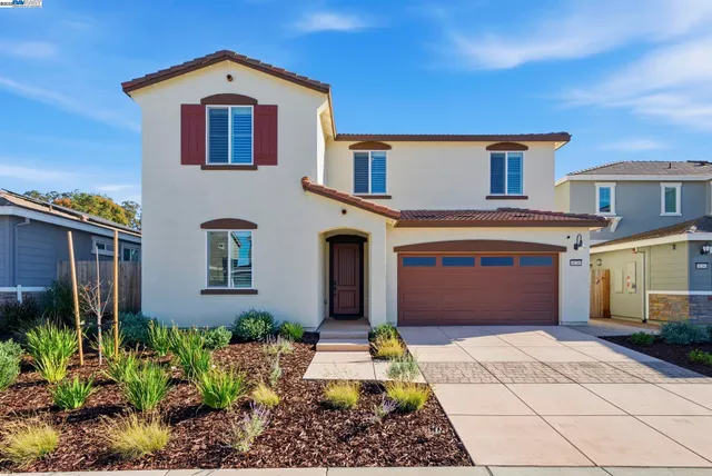 a aerial view of a house with a yard