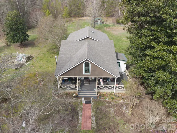 a aerial view of a house with a yard