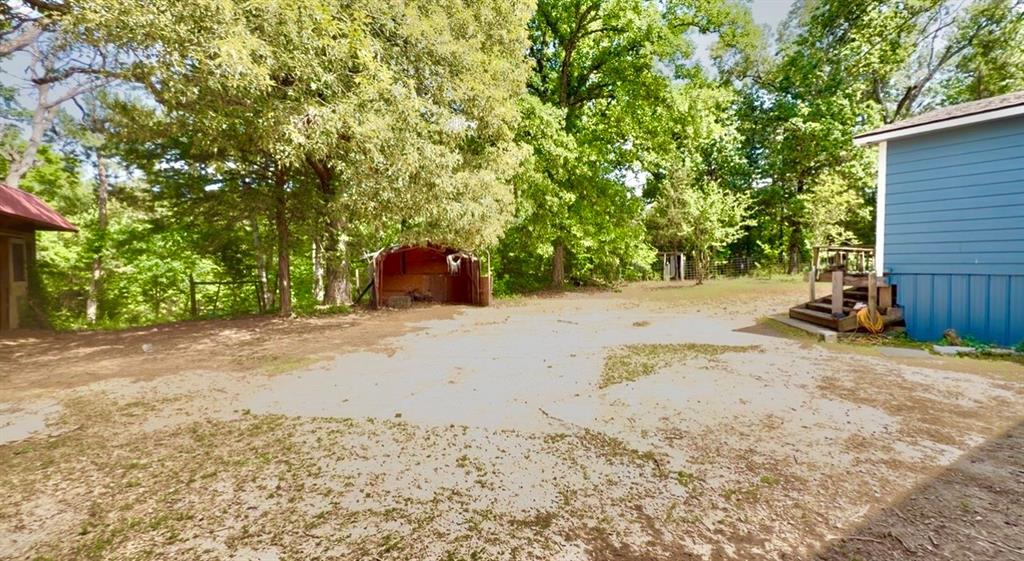 8261 County Road 381 Tyler, TX 75708 - Photo 19 of 40 a view of a backyard of a house