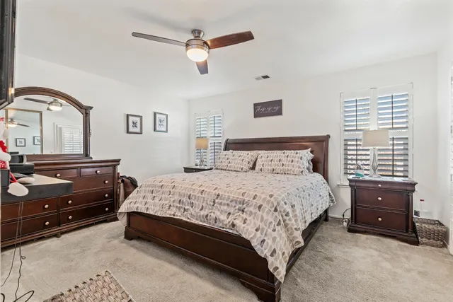 a bedroom with a bed and a dresser