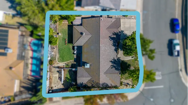 an aerial view of a house with a garden and plants