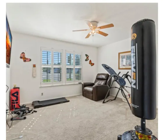 a room with gym equipment and a window