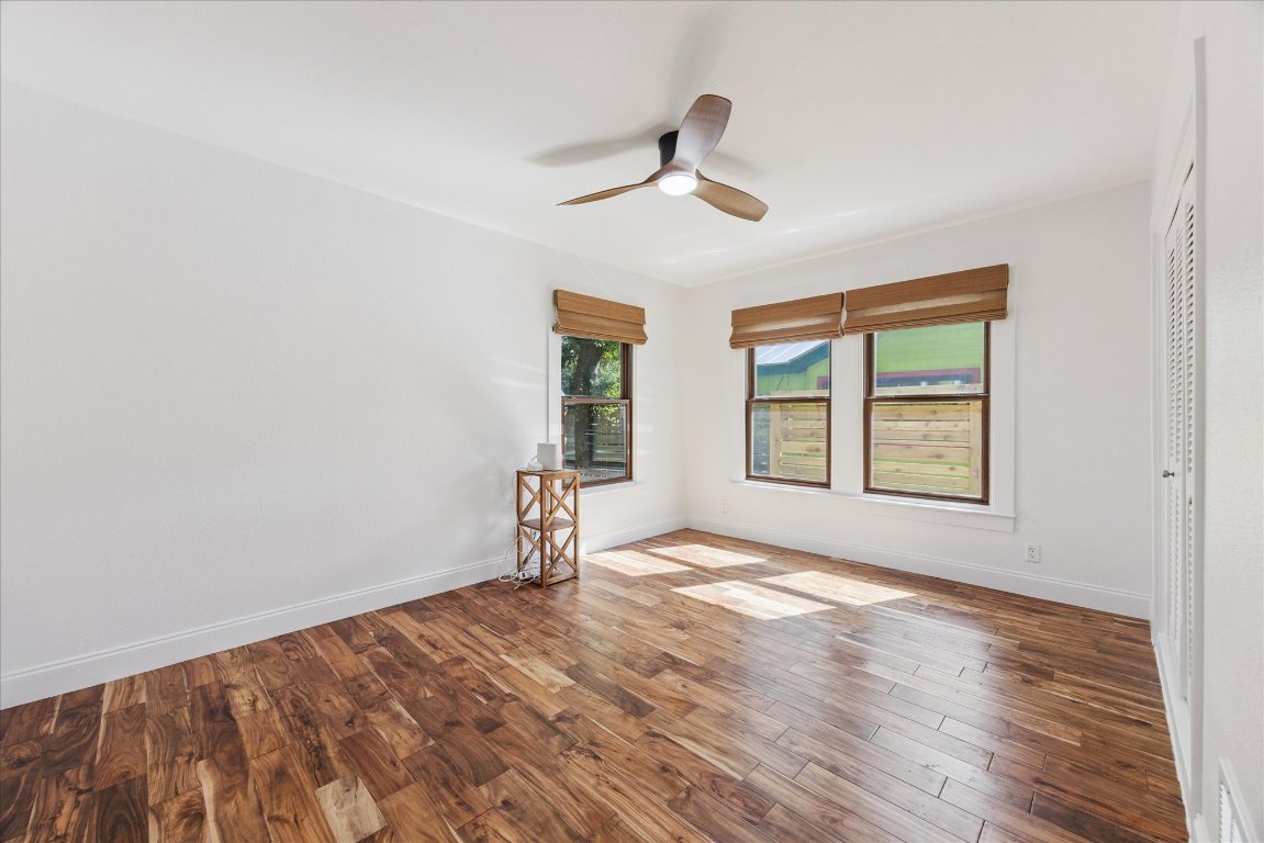 1106 Fairmount Avenue Austin, TX 78704 - Photo 17 of 25 a view of empty room with wooden floor and fan
