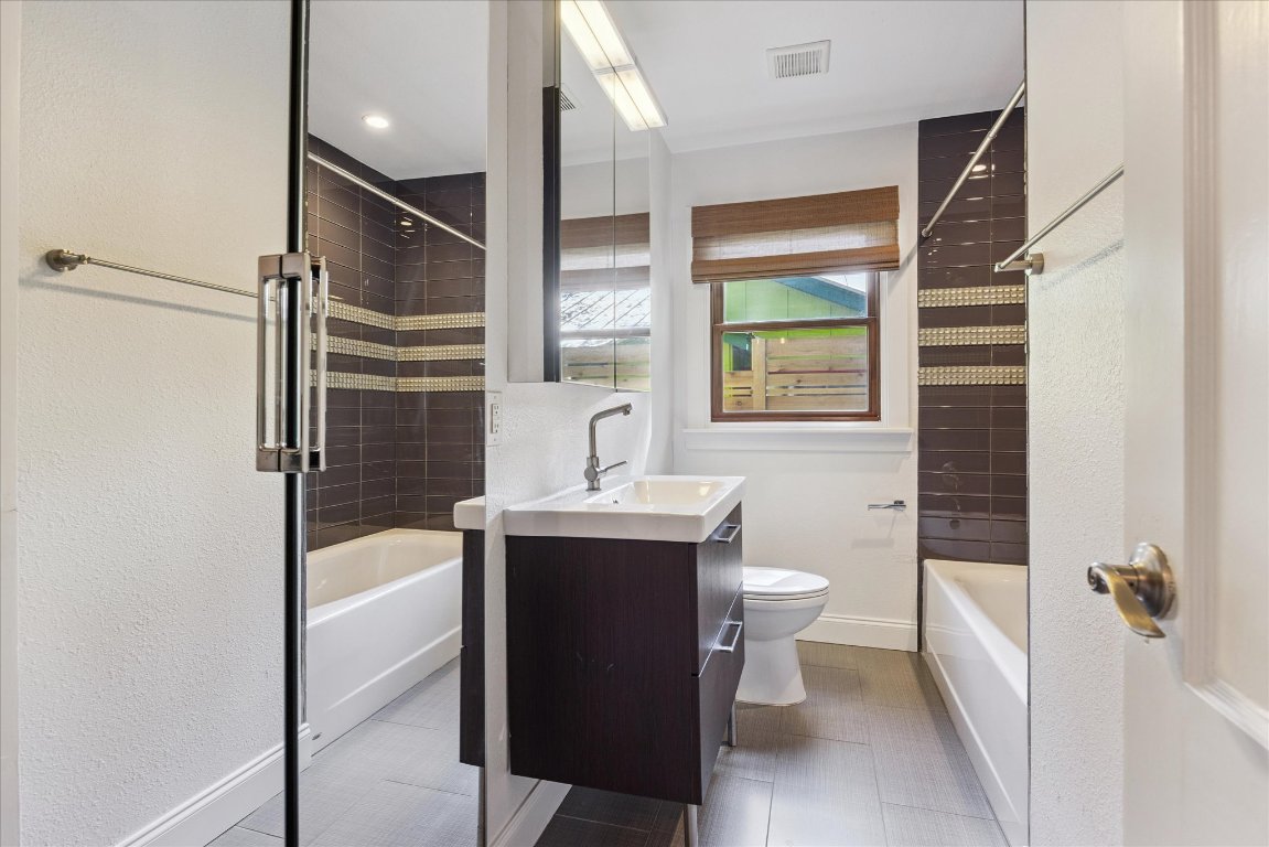 1106 Fairmount Avenue Austin, TX 78704 - Photo 18 of 25 a bathroom with a sink toilet and shower