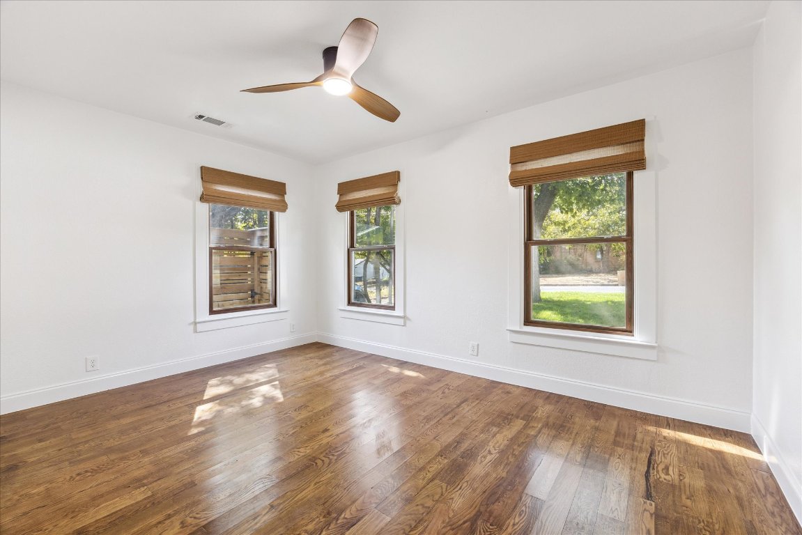 1106 Fairmount Avenue Austin, TX 78704 - Photo 19 of 25 a view of an empty room with wooden floor and a window