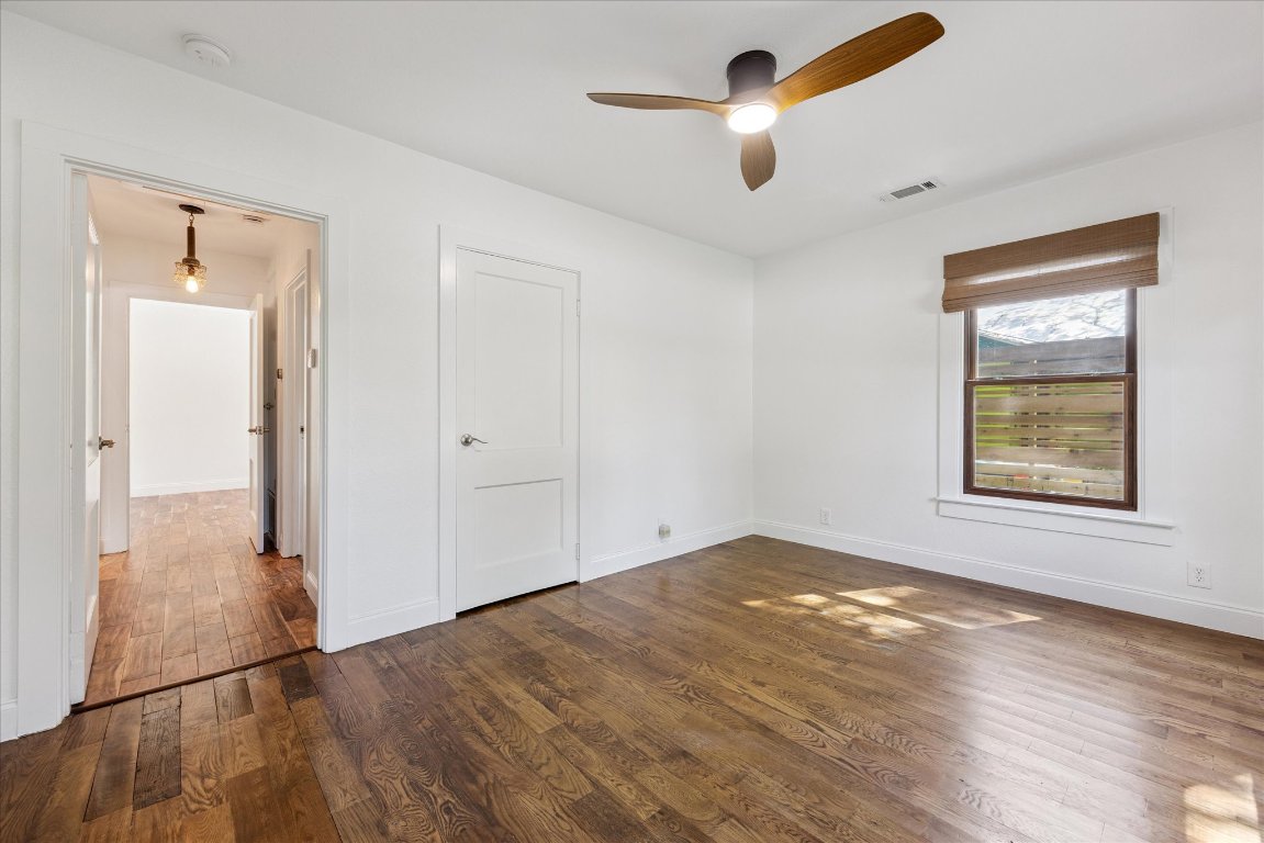 1106 Fairmount Avenue Austin, TX 78704 - Photo 20 of 25 wooden floor in an empty room with a window